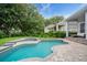 Inviting backyard pool and spa area, perfect for relaxation and entertaining with a fenced yard at 11537 Claymont Cir, Windermere, FL 34786