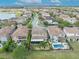 Aerial view of the home with well-maintained backyard, pool and golf course at 13067 Woodford St, Orlando, FL 32832