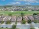 Aerial view of the neighborhood homes with a golf course and community lakes at 13067 Woodford St, Orlando, FL 32832