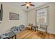 Relaxing room featuring hardwood floors, neutral paint, natural light, and a stylish ceiling fan at 13067 Woodford St, Orlando, FL 32832