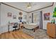 Bright bedroom with a ceiling fan, desk, chair, and cozy bed with a patterned blanket, creating a comfortable space at 13067 Woodford St, Orlando, FL 32832
