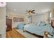 A spacious bedroom with wood flooring, natural light, and neutral decor with custom trim at 13067 Woodford St, Orlando, FL 32832