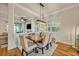 Dining area featuring built-in seating and a modern light fixture at 13067 Woodford St, Orlando, FL 32832