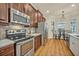 Bright kitchen with stainless steel appliances and a breakfast nook at 13067 Woodford St, Orlando, FL 32832