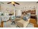 Spacious living room with an open layout, hardwood floors, and comfortable seating at 13067 Woodford St, Orlando, FL 32832