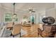Bright open-concept dining and living area with hardwood floors and lots of light at 13067 Woodford St, Orlando, FL 32832