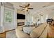 Comfortable living room with a brick fireplace and open layout at 13067 Woodford St, Orlando, FL 32832