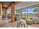 Inviting screened patio offers ample seating, brick pavers, and serene views of the community and its landscaping at 13067 Woodford St, Orlando, FL 32832