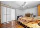 Bedroom with wood floors, a bright window, and ample closet space at 144 E Plantation Blvd, Lake Mary, FL 32746