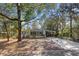 Inviting single-story home with a carport and mature trees at 144 E Plantation Blvd, Lake Mary, FL 32746