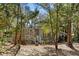 Cozy single-story home with lovely porch, white railing and blossoming plants at 144 E Plantation Blvd, Lake Mary, FL 32746