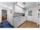 Bright kitchenette with modern white cabinets, granite countertops and stylish backsplash at 144 E Plantation Blvd, Lake Mary, FL 32746
