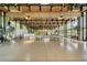 Large meeting room featuring high ceilings, ceiling fans, televisions, stage, and floor to ceiling windows at 144 E Plantation Blvd, Lake Mary, FL 32746