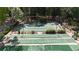 Elevated view of shuffleboard courts surrounded by green spaces and well-maintained landscaping at 144 E Plantation Blvd, Lake Mary, FL 32746