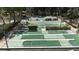 Overhead view of shuffleboard courts with mini golf, surrounded by green spaces and well-maintained landscaping at 144 E Plantation Blvd, Lake Mary, FL 32746