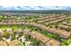 Aerial view of a neighborhood with well-maintained homes, pools, and landscaping at 1445 Rolling Fairway Dr, Davenport, FL 33896