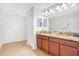 Elegant bathroom with double vanity, granite countertops, and ample cabinet space, offering both style and functionality at 1445 Rolling Fairway Dr, Davenport, FL 33896