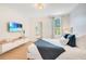 Bright bedroom with stylish decor, ample natural light, and a contemporary design, perfect for relaxation and comfort at 1445 Rolling Fairway Dr, Davenport, FL 33896