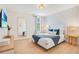 Bright bedroom with stylish decor, large mirror, and ample natural light, offering a comfortable and contemporary living space at 1445 Rolling Fairway Dr, Davenport, FL 33896
