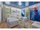 Playful bedroom with 'Frozen' themed decor, two twin beds, and whimsical snowflake accents at 1445 Rolling Fairway Dr, Davenport, FL 33896