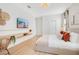 Bright bedroom featuring a modern floating shelf and decorative wall art at 1445 Rolling Fairway Dr, Davenport, FL 33896