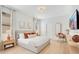 Serene bedroom with a cozy bed, stylish furnishings, and warm lighting for a relaxing atmosphere at 1445 Rolling Fairway Dr, Davenport, FL 33896