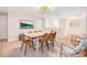 Bright dining room with a large dining table, seating, and stylish accent wall at 1445 Rolling Fairway Dr, Davenport, FL 33896