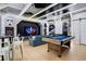 Spacious game room with a pool table, Star Wars themed decor, and arcade games at 1445 Rolling Fairway Dr, Davenport, FL 33896