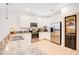 Modern kitchen featuring stainless steel appliances, granite countertops, and a built in wine cooler at 1445 Rolling Fairway Dr, Davenport, FL 33896