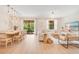 Open-concept living and dining area filled with natural light, perfect for entertaining guests at 1445 Rolling Fairway Dr, Davenport, FL 33896