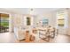Bright living room with a comfortable sofa, modern entertainment center, and seamless indoor-outdoor flow at 1445 Rolling Fairway Dr, Davenport, FL 33896