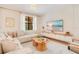 Cozy living room featuring modern decor, a comfortable sectional sofa, and a sleek entertainment center at 1445 Rolling Fairway Dr, Davenport, FL 33896