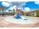 Community splash pad with slides and play area at 1445 Rolling Fairway Dr, Davenport, FL 33896