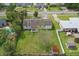 Aerial view of the property showcasing a large backyard, mature trees, and a private pool at 1612 Eastbrook Blvd, Winter Park, FL 32792