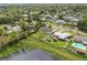 Aerial view of the property highlighting the large backyard, mature trees, pond, and neighborhood at 1612 Eastbrook Blvd, Winter Park, FL 32792