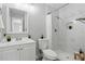 Modern bathroom featuring marble tile, a shower, and a sleek vanity at 1612 Eastbrook Blvd, Winter Park, FL 32792