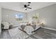 Bright bedroom featuring a ceiling fan, neutral walls, and stylish decor at 1612 Eastbrook Blvd, Winter Park, FL 32792