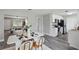 Dining area flows into the kitchen, with modern white cabinets and stainless steel appliances at 1612 Eastbrook Blvd, Winter Park, FL 32792