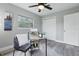 Comfortable home office featuring a stylish desk, a chair, and a large window at 1612 Eastbrook Blvd, Winter Park, FL 32792