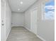 Bright laundry room with grey flooring, neutral walls and door to the outside at 1612 Eastbrook Blvd, Winter Park, FL 32792