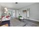 Bright living room featuring stylish decor, wood-look floors, and an open layout into the dining area at 1612 Eastbrook Blvd, Winter Park, FL 32792