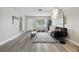 Spacious living room featuring modern decor, wood-look floors, and an open layout at 1612 Eastbrook Blvd, Winter Park, FL 32792