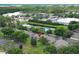 Aerial shot showcasing the neighborhood with ponds and lush landscaping with a red pin at 164 Reserve Cir # 208, Oviedo, FL 32765