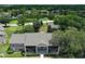 Aerial view of the community buildings with a basketball court and pond at 164 Reserve Cir # 208, Oviedo, FL 32765