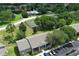Aerial view of property showing basketball court, community pool, and surrounding landscape at 164 Reserve Cir # 208, Oviedo, FL 32765