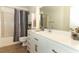 This renovated bathroom has a white vanity, modern hardware, and a shower-tub combo at 164 Reserve Cir # 208, Oviedo, FL 32765