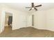 Bedroom with wood-look flooring and access to bathroom at 164 Reserve Cir # 208, Oviedo, FL 32765