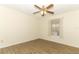 This bedroom includes wood-look floors and a window at 164 Reserve Cir # 208, Oviedo, FL 32765