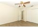 This bedroom features a ceiling fan and durable wood-look floors at 164 Reserve Cir # 208, Oviedo, FL 32765