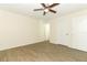 This bedroom features a ceiling fan and durable wood-look floors at 164 Reserve Cir # 208, Oviedo, FL 32765